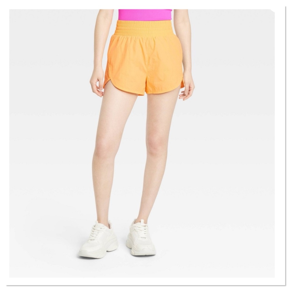 Women’s High-Rise Crinkle Orange Athletic Shorts all in motion